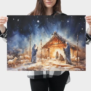 May include: A watercolor painting depicting the nativity scene with a star-filled night sky. The scene includes a stable with a straw roof, a manger with a baby inside, and three figures standing outside the stable. The figures are dressed in blue robes and are looking at the baby in the manger.