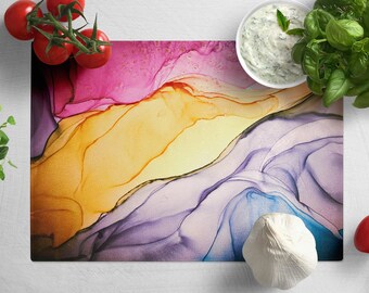 Peut inclure: Planche à découper de cuisine en verre trempé avec un motif abstrait coloré de rose, jaune, violet et bleu. La planche est résistante à la chaleur.
