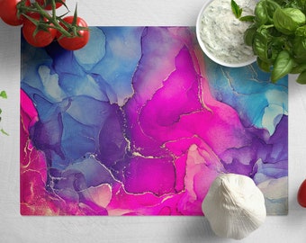 May include: A rectangular cutting board with an abstract design featuring swirls of blue, purple, and pink with gold accents.