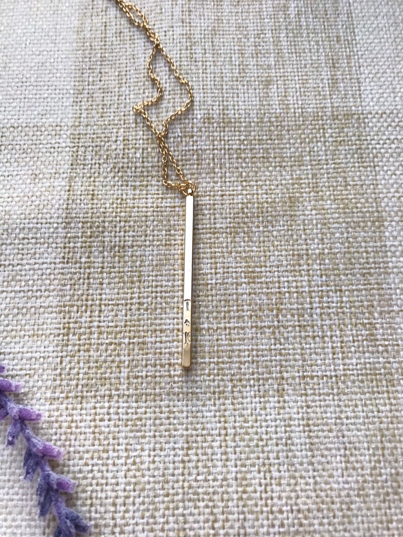 custom hand stamped gold four sided vertical bar necklace