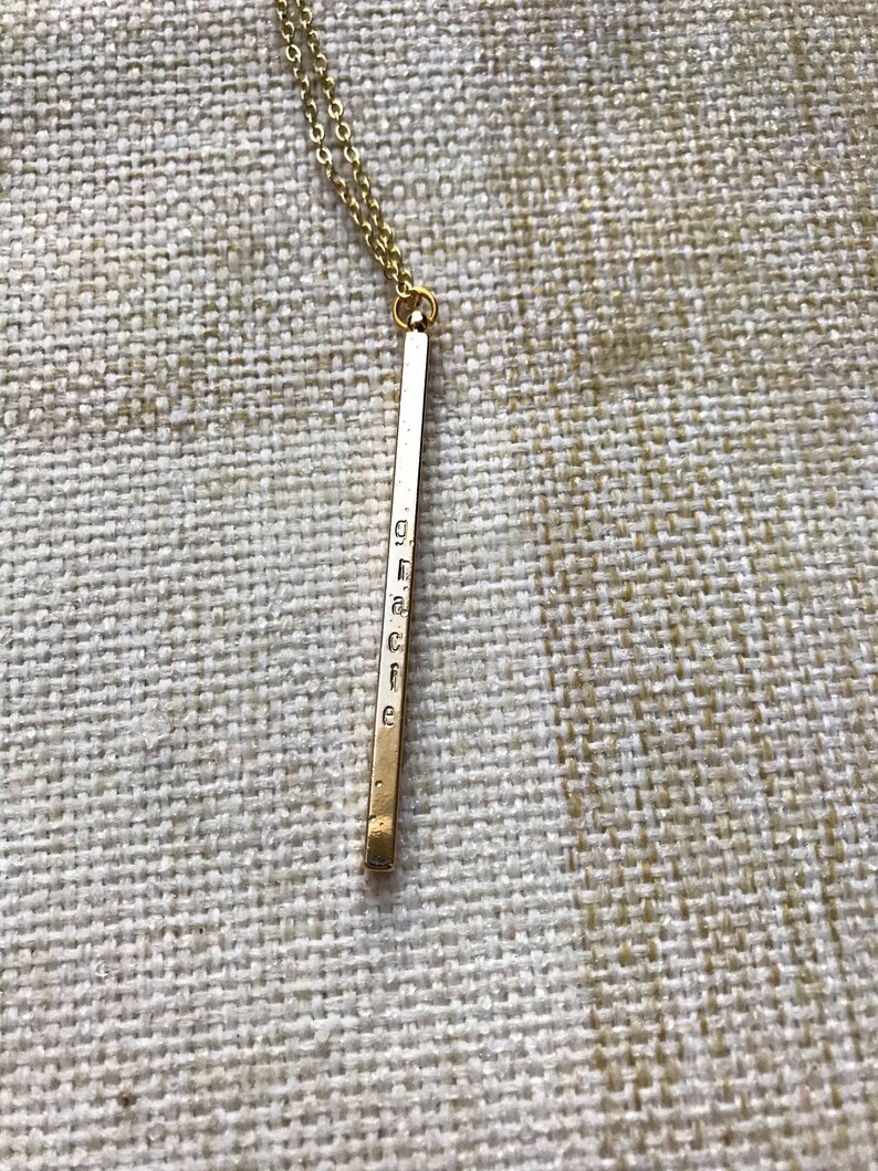 custom hand stamped gold four sided vertical bar necklace