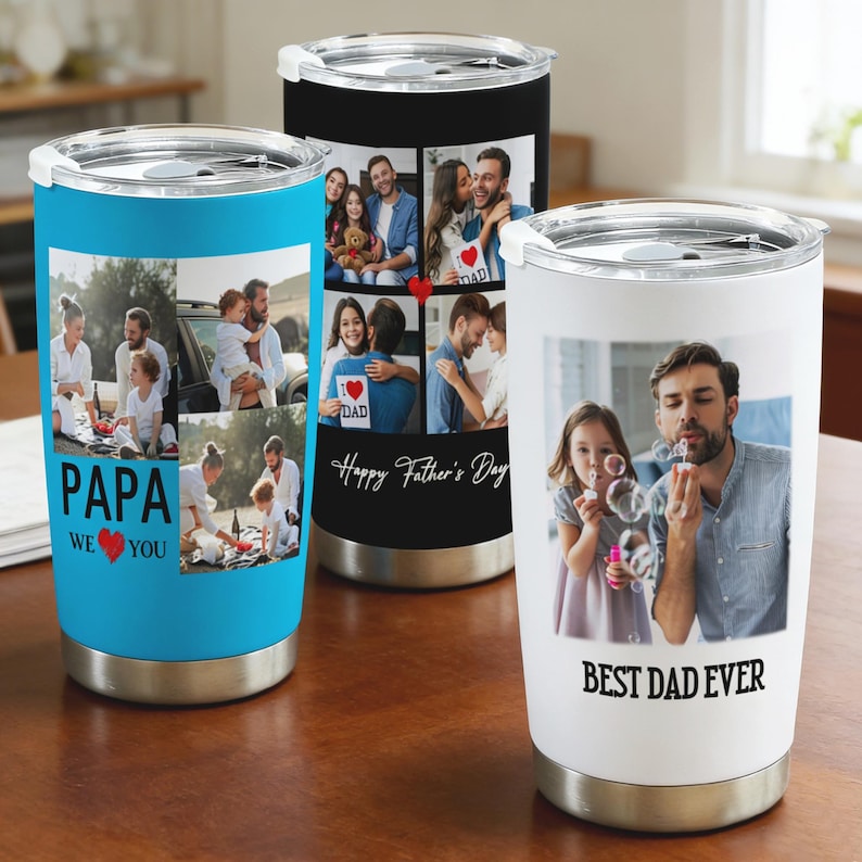 May include: Three stainless steel insulated tumblers with family photos. One is light blue with "PAPA WE ❤️ YOU" text, another is black with "Happy Father's Day" text, and the third is white with "BEST DAD EVER" text.