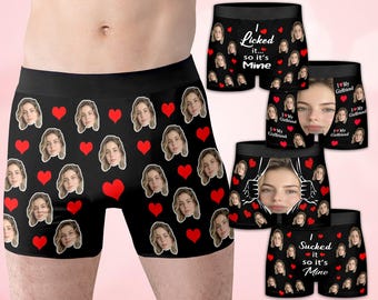 May include: Black boxer briefs with a repeating pattern of a woman's face and red hearts. Additional briefs feature the phrases "I Licked it... so it's Mine" and "I ❤️ My Girlfriend."