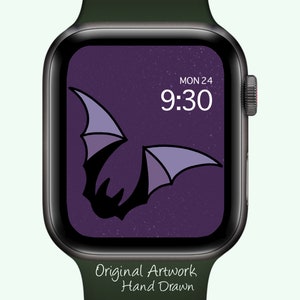 May include: A smartwatch with a dark green band displays a purple bat design on its screen. The screen shows the date, Monday the 24th, and the time, 9:30. The words "Original Artwork Hand Drawn" are at the bottom of the watch face.
