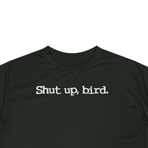 May include: Black t-shirt with white text that reads "Shut up, bird."