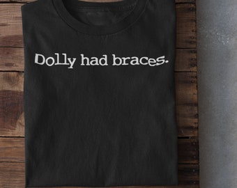 Mandela Effect | Conspiracy Shirt | Funny Conspiracy I Paranoid Shirt | Dolly Had Braces - Unisex softstyle tee