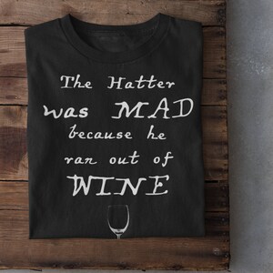 The Mad Hatter loves wine!  Alice in Wonderland Shirt - Unisex Softstyle Tee