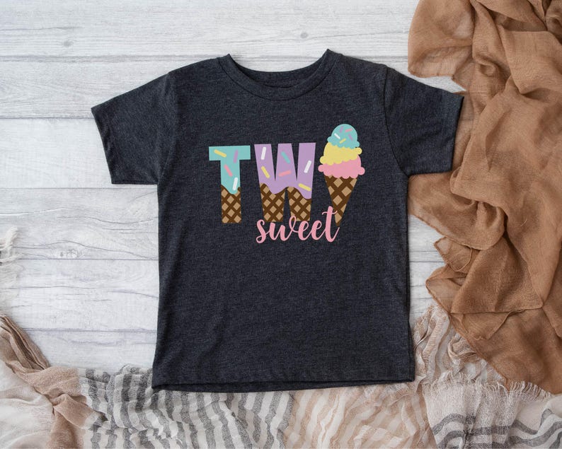 May include: A dark grey t-shirt with a graphic of two ice cream cones that spell out "TWO sweet".