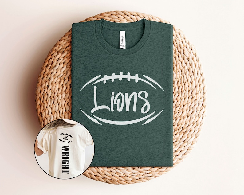 May include: A dark green t-shirt with a white football graphic and the word "Lions" in a white script font. A white t-shirt with the number "15" and the name "Wright" in black text is shown in the background.