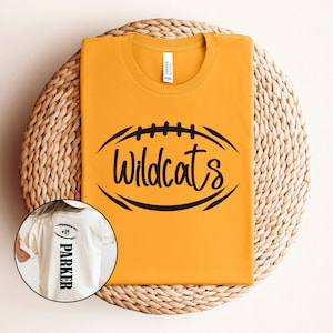 May include: A yellow t-shirt with a black football graphic and the text "Wildcats". A white t-shirt with the text "Parker" and a football graphic is also shown.