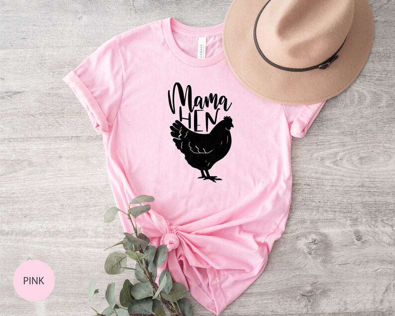 May include: Pink t-shirt with a black silhouette of a chicken and the text "Mama Hen".