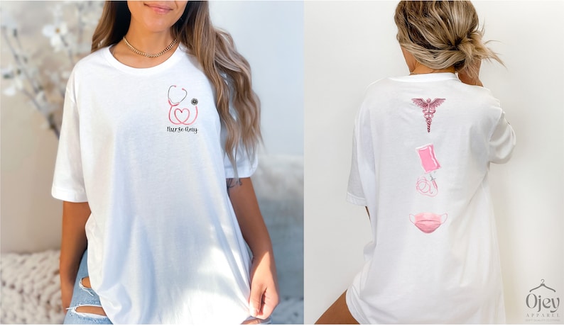 May include: White t-shirt with a pink stethoscope, heart, and eye graphic on the front and the text "Nurse Day". The back of the shirt has a pink caduceus, syringe, and face mask graphic.