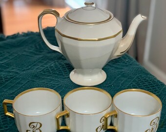 Edwin M Knowles China Co Vitreous teapot and 3 German Gold Monogrammed Cup