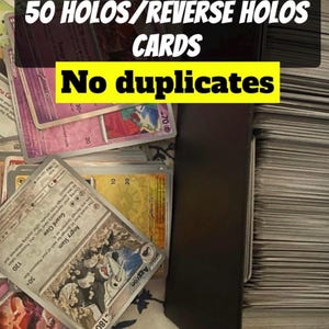 May include: A collection of trading cards, including holos and reverse holos, with the text "50 HOLOS/REVERSE HOLOS CARDS No duplicates". The cards are in a black box, with some cards visible.