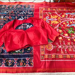Midnight blue color Ikat silk Saree with double Patola weave.