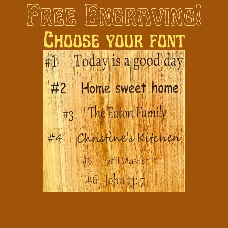 May include: A wooden board with six different font styles for engraving. The text on the board reads: "FREE ENGRAVING! CHOOSE YOUR FONT #1 Today is a good day #2 Home sweet home #3 The Eaton Family #4 Christine's Kitchen #5 Grill Master #6 John 13:7"