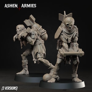 May include: Two unpainted grey resin miniature figures from Ashen Armies. One figure carries a large bomb on its back with rope bindings, while the other wears a spherical mask and holds a wooden crate. Both figures feature tattered clothing.