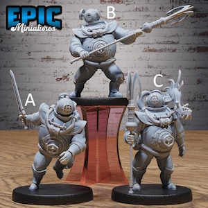 May include: Three grey miniature figures of divers in vintage diving suits, each holding a different weapon: a sword, a spear, and a trident. The figures are on black bases, with the text "EPIC Miniatures" in the upper left corner.