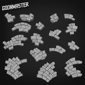 May include: A selection of grey, stone-like game pieces, each with a unique shape and texture, set against a dark background. The text "GOONMASTER" is displayed in the upper left corner. These pieces appear to be for a tabletop game.