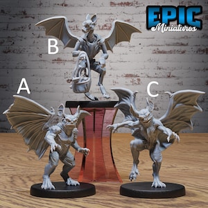 May include: Three unpainted gray resin miniature figures labeled A, B, and C. Figure A is a winged creature with pointed ears. Figure B is a winged creature holding a basket. Figure C is a winged creature with a wide grin. The text Epic Miniatures is visible.