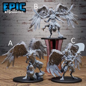 May include: Epic Miniatures figurines. Three detailed fantasy miniatures are displayed. One figure stands on a pedestal, holding two swords. The other two figures are on black bases, one kneeling and the other holding a curved blade. All have large feathered wings.