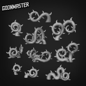 May include: A collection of gray, stylized, thorny vine models. The vines are in various shapes, including spirals and curves, and are designed for use in crafting or model-making projects. The text "GOONMASTER" is in the upper left corner.