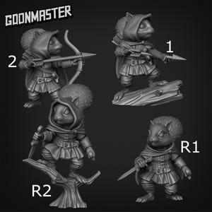 Puede incluir: Cuatro figuras en miniatura de ardillas antropomórficas con atuendo medieval. Cada ardilla posa con un arma, incluyendo arco y flecha, lanza y espada. Las figuras están numeradas 1, 2, R1 y R2. El texto "GOONMASTER" está en la parte superior.