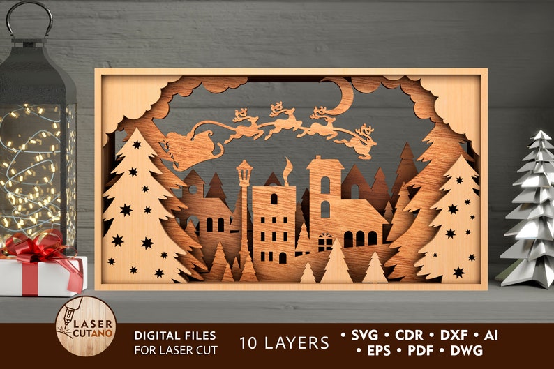 May include: A laser cut wooden Christmas scene with a town, trees, and Santa Claus flying in a sleigh with reindeer. The scene is made up of 10 layers and is ready to be assembled.