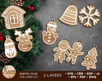 May include: A set of nine laser cut Christmas ornaments featuring a variety of designs, including a gingerbread house, a snowman, a reindeer, Santa Claus, a bell, a snowflake, a gingerbread person, a gingerbread girl, and a Christmas tree. The ornaments are made of wood and have a white painted design.
