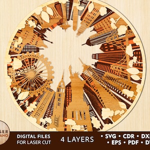 May include: A circular wooden laser-cut design featuring iconic cityscapes, including the Statue of Liberty and the London Eye. The design is multi-layered with intricate details and a natural wood finish. The text "DIGITAL FILES FOR LASER CUT" is visible.
