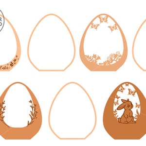 May include: Six different laser cut Easter egg designs. The designs include a bunny, butterflies, flowers, and the text "Happy Easter".