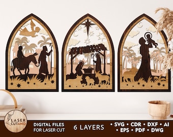 May include: Three wooden laser cut panels depicting the Nativity scene. The first panel shows Mary and Joseph riding a donkey, the second panel shows the manger scene with the baby Jesus, and the third panel shows Mary holding baby Jesus.