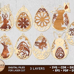May include: A collection of laser-cut wooden Easter egg decorations. The designs include bunnies, butterflies, and floral motifs. Some eggs have the words "Happy Easter". Digital files for laser cutting, with 3 layers.