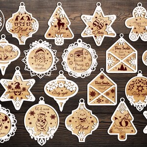 Puede incluir: Conjunto de 20 dise&ntilde;os de adornos navide&ntilde;os de corte l&aacute;ser blanco. Los adornos presentan varios temas navide&ntilde;os, que incluyen "Feliz Navidad", "Noel", "Que nieve", "Querido Santa" y "Nochebuena".