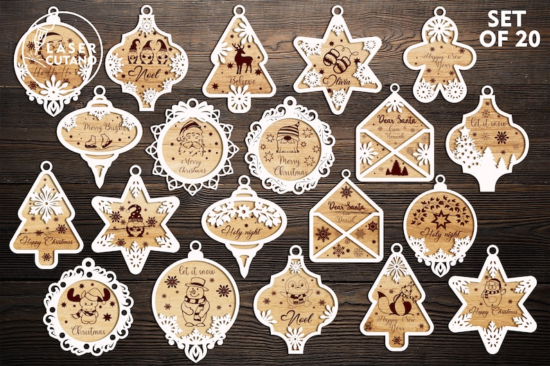 Puede incluir: Conjunto de 20 dise&ntilde;os de adornos navide&ntilde;os de corte l&aacute;ser blanco. Los adornos presentan varios temas navide&ntilde;os, que incluyen "Feliz Navidad", "Noel", "Que nieve", "Querido Santa" y "Nochebuena".