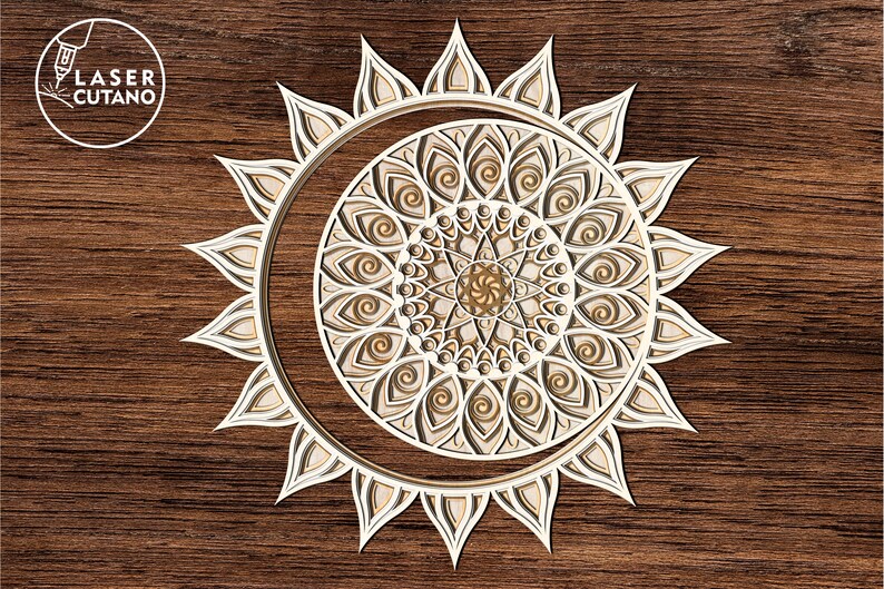 May include: A white, intricate mandala design with a sunburst pattern, cut from wood. The mandala is set against a brown wood background.