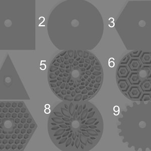 May include: Nine different gray shapes with a hole in the center. The shapes include a square, circle, hexagon, triangle, and various patterned circles.