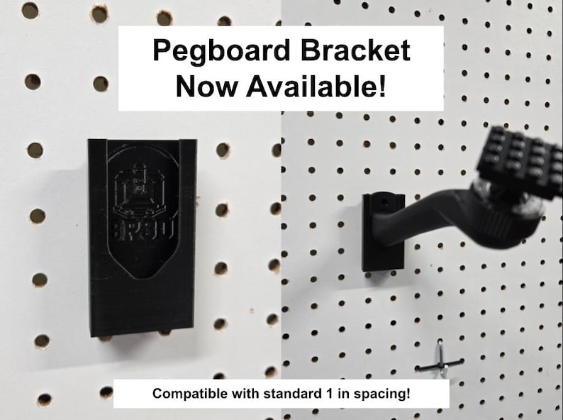 May include: A black pegboard bracket mounted on a white pegboard with holes. The text reads Pegboard Bracket Now Available! and Compatible with standard 1 in spacing! The bracket features a shield-shaped logo with the text 3R30 on its front surface.
