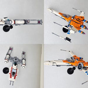 May include: A collection of two plastic building block starfighter models mounted on black circular stands. One model is a white and gray Y-wing starfighter, and the other is an orange and white X-wing starfighter with four wings in an open position.