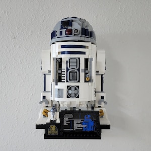 Wall mount for LEGO R2-D2 75308 wall mounted display with plaque and minifigure on black floating shelf