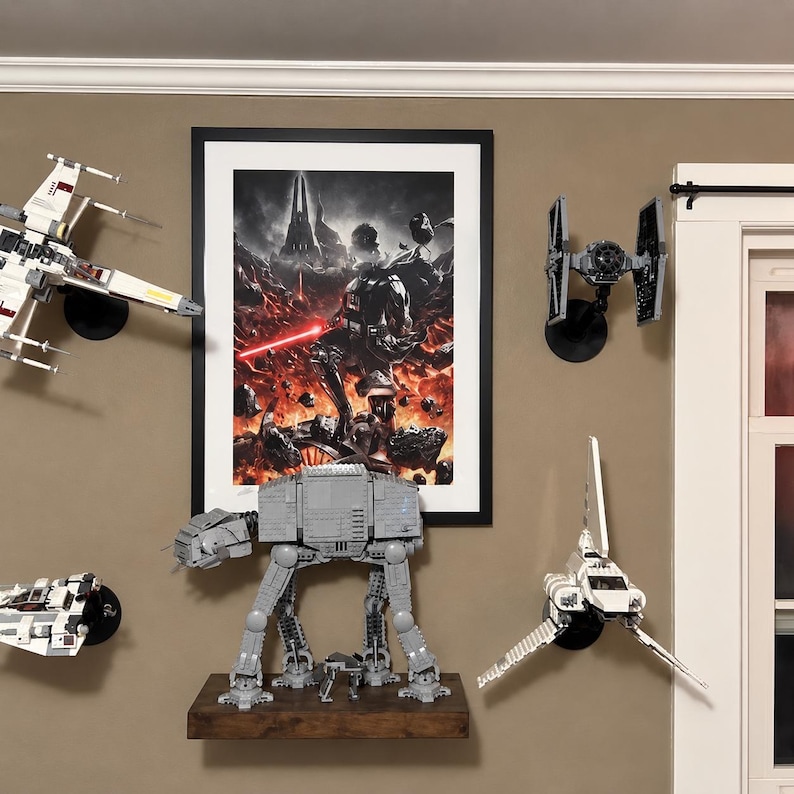 May include: A wall display featuring a framed poster of Darth Vader with a red lightsaber, surrounded by mounted LEGO starship models including an X-wing, a TIE fighter, a shuttle, and a large gray AT-AT walker standing on a wooden shelf.