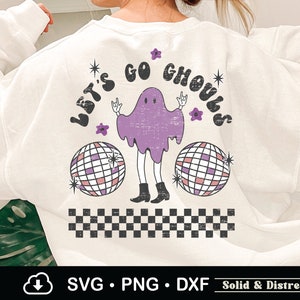 May include: White sweatshirt with a purple ghost wearing a disco ball and the text "Let's Go Ghouls" in a retro font. The ghost has a distressed look and is surrounded by stars and flowers.
