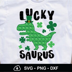 Lucky Saurus T-Rex Poppin Svg, Lucky Saurus Svg, St. Patrick’s T-Rex Svg, Dinosaur St Patty Svg, Boy St Patricks Shirt Svg, Cricut, Png,Dxf