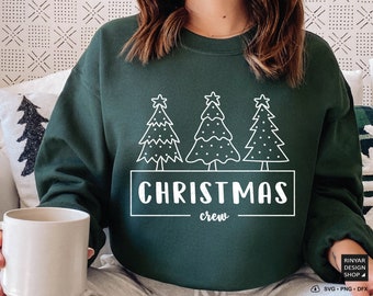 Könnte beinhalten: Ein grüner Pullover mit einem weißen Design aus drei Weihnachtsbäumen und dem Text "Christmas crew".