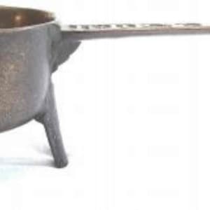 May include: A small, antique, bronze, three-legged pot with a long handle. The pot has a worn, aged patina.