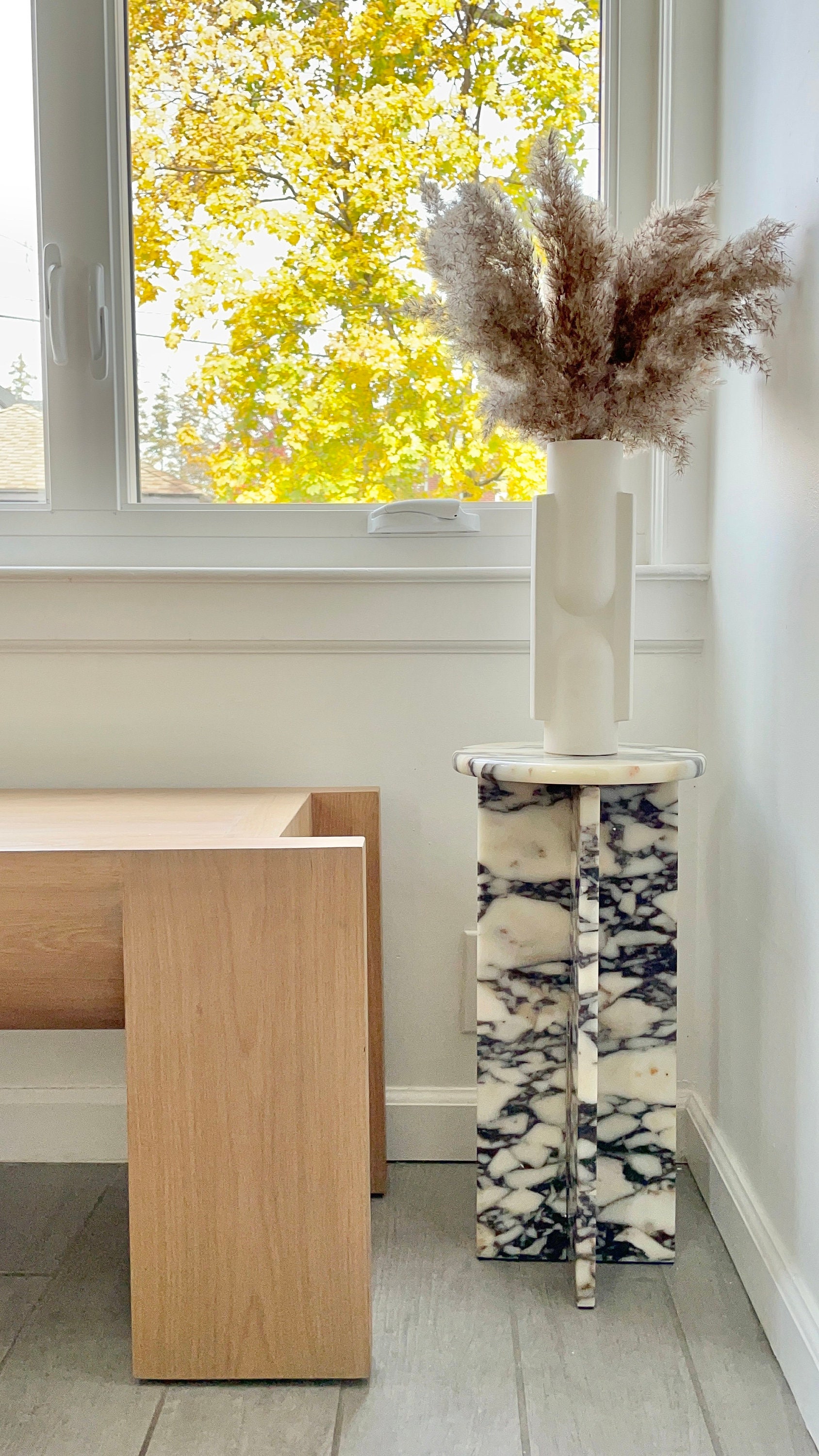 Stone pedestal coffee table deals
