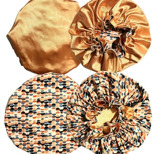 May include: Four satin hair bonnets, two are solid gold and two have a geometric pattern of orange, blue, and black circles on a white background.