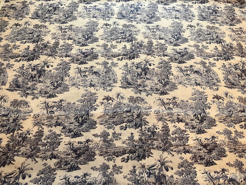 May include: A beige fabric with a repeating pattern of black trees, plants, and animals. The pattern is reminiscent of a toile design.