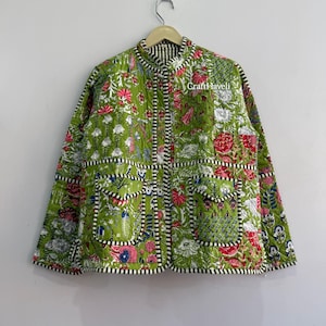 May include: A quilted jacket in lime green featuring a floral block print in shades of pink, white, and blue. The jacket has a mandarin collar, long sleeves, two front patch pockets with flaps, and black and white striped trim. Text reads Craft Haveli.