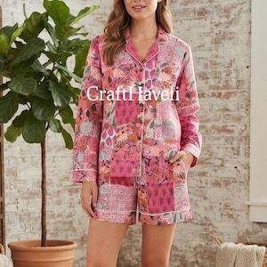 May include: A two-piece pyjama set featuring a long-sleeved button-down shirt and matching shorts in a vibrant pink floral and geometric patchwork print with white piping trim. The text CraftHaveli is visible across the chest area.